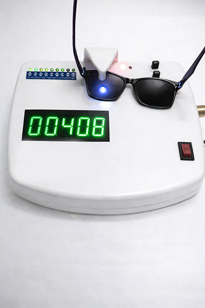 UV protection testing of first copy sunglasses wholesale in Mumbai showing clear lenses under UV test machine to ensure safe and glare-free vision for retail sale across India